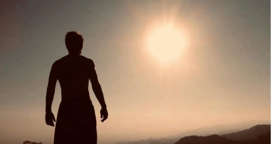 Julius Cole Rassin silhouette at sunset on a hillside
