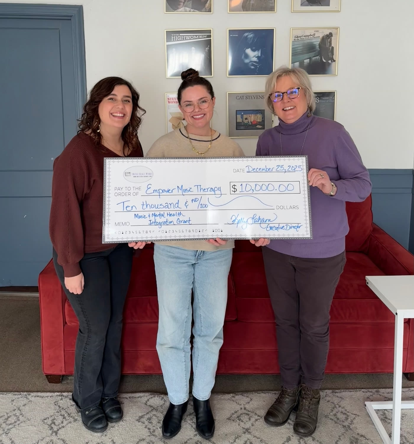 Kelly Laham presenting a $10,000 Music & Mental Health Integration Grant to Empower Music Therapy, December 2025