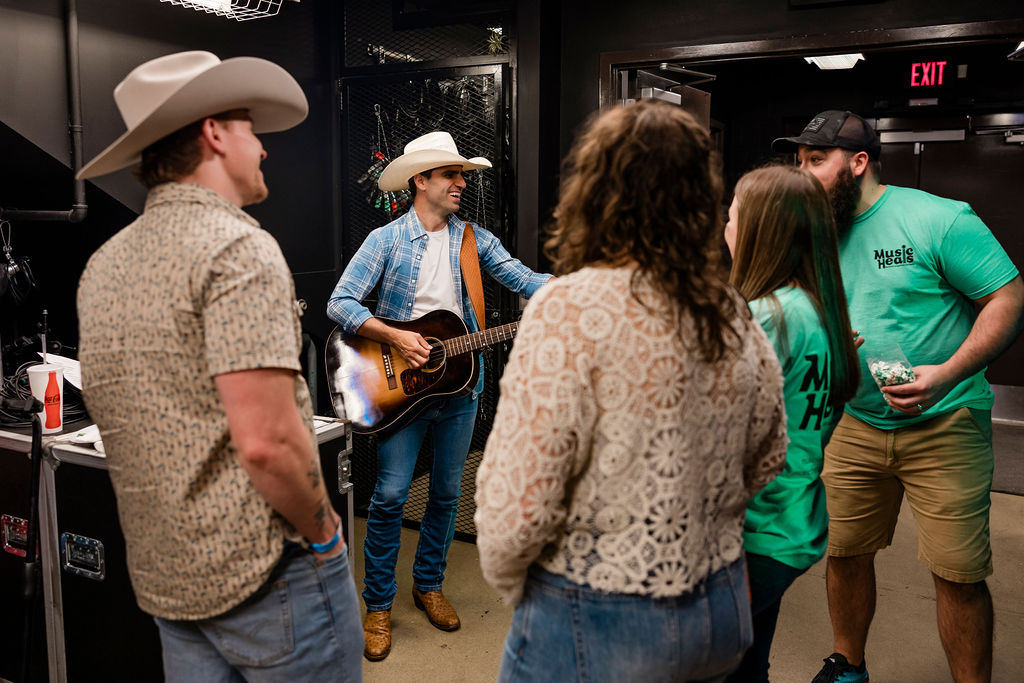 Lead performer with band at the 2025 fundraiser